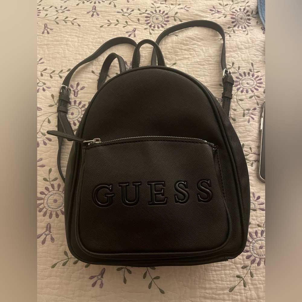 COPY - This is a small Guess brand backpack,  new and unused.